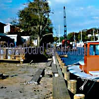 Our crane, tugboat and a dumpster